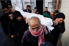 Mourners carrying the body of Naseem Abu Fuda